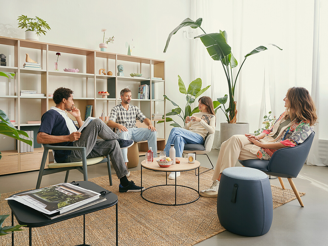 People sit in a communicative zone in the office