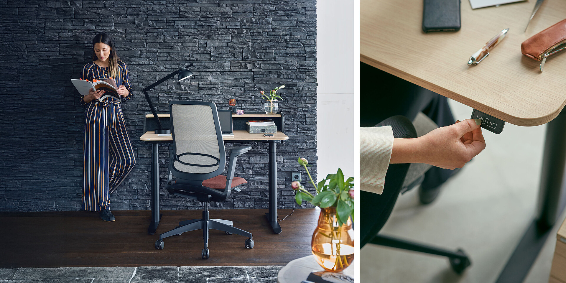 Standing desk with ergonomic office chair in front of a dark stone wall, plant on the floor, person holding a book.